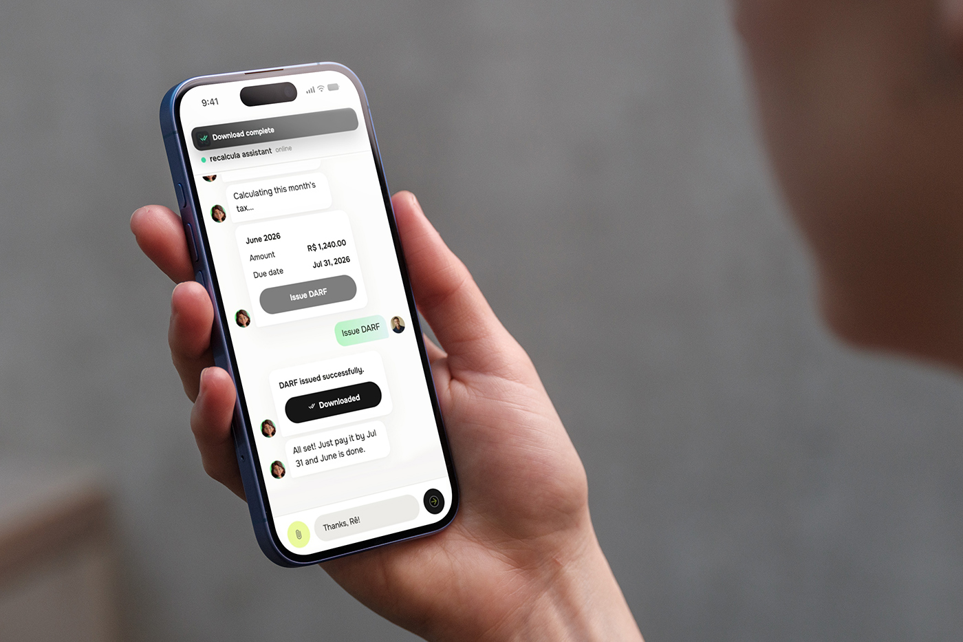 Hand holding a phone showing a DARF issued inside the chat with Rê